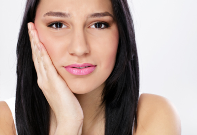 a dental implant patient in tooth pain.