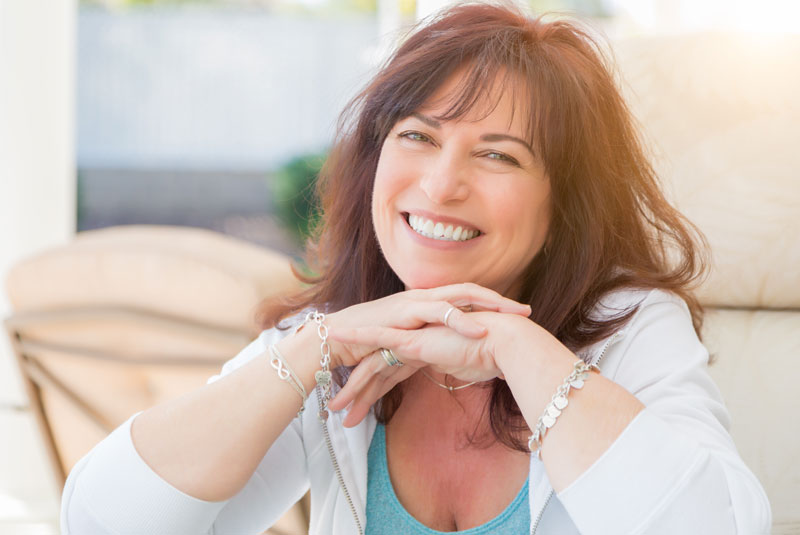 dental patient smiling after dental implants procedure.