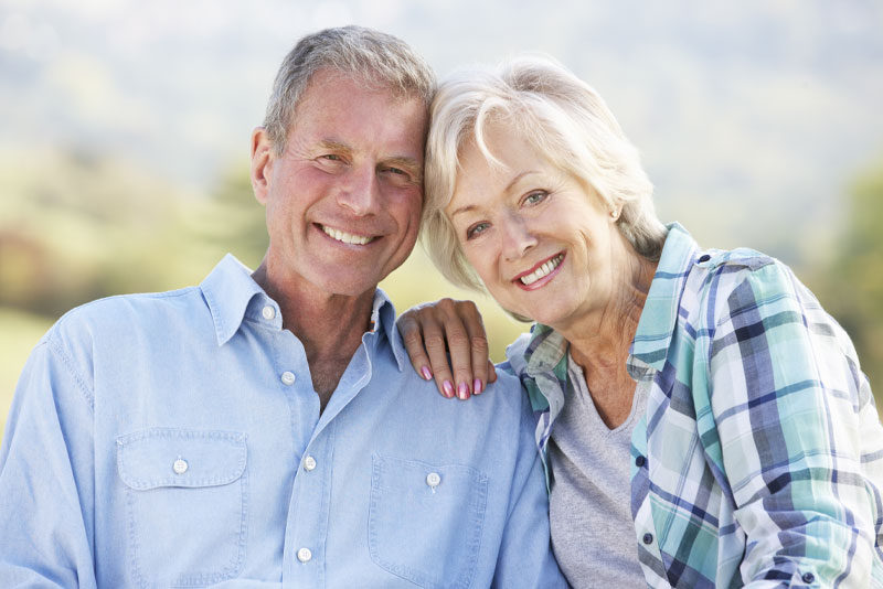 dental implant patients smiling together.