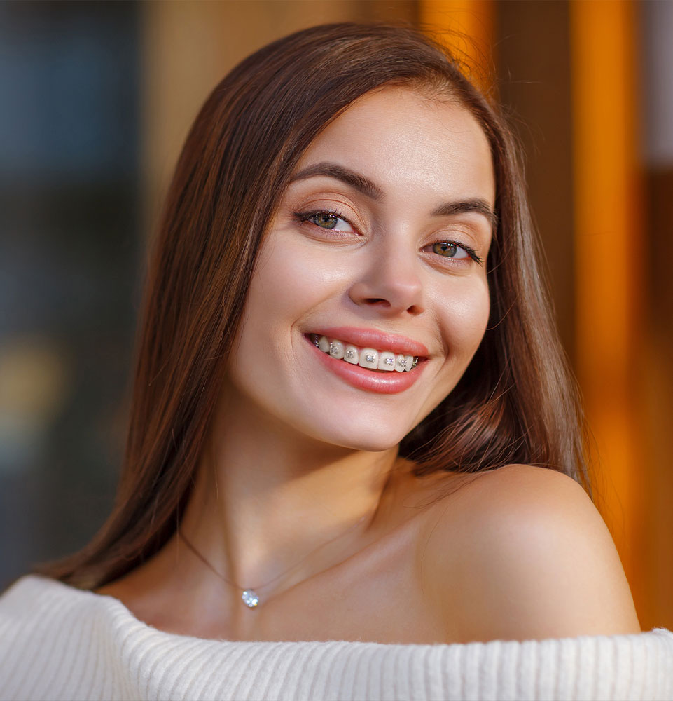 patient smiling confidently after having their braces inserted